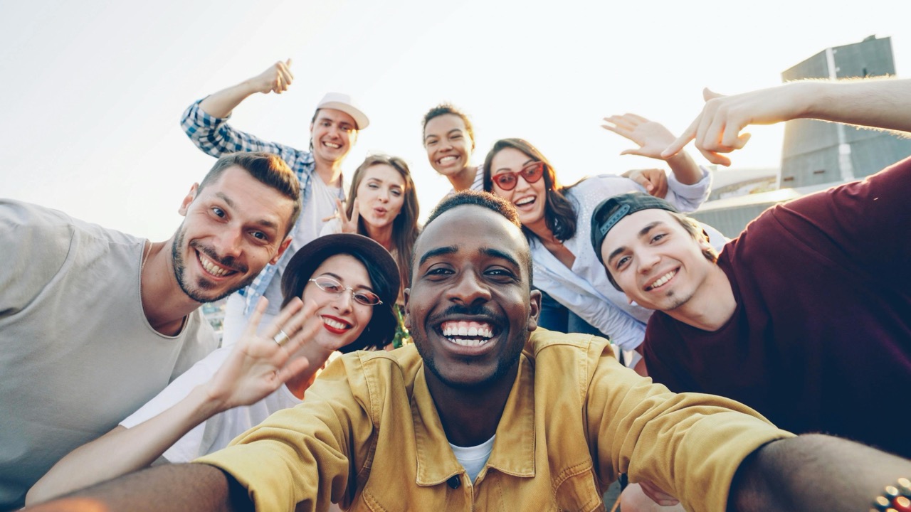 Joyful Group Selfie at Sunset Outdoors